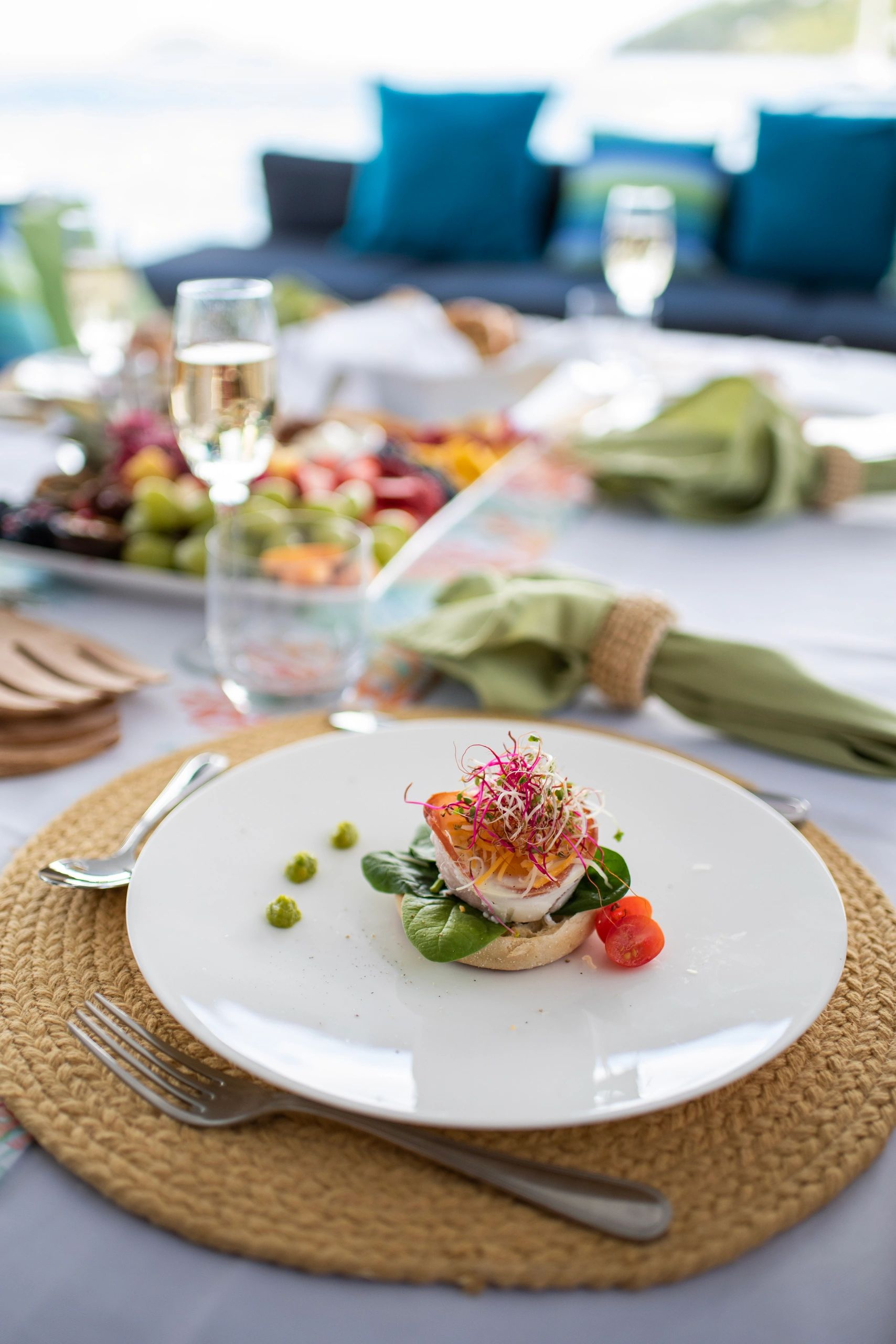 Elegantly plated gourmet dining aboard Ripple at outdoor table setting
